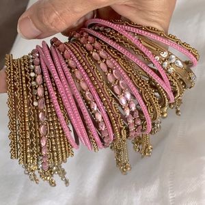 Pink/gold tone India bangles w/crystals & charms